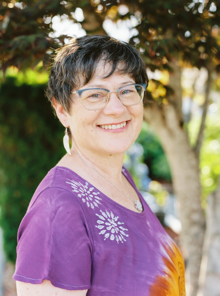 Christine Zyla smiling and welcoming clients